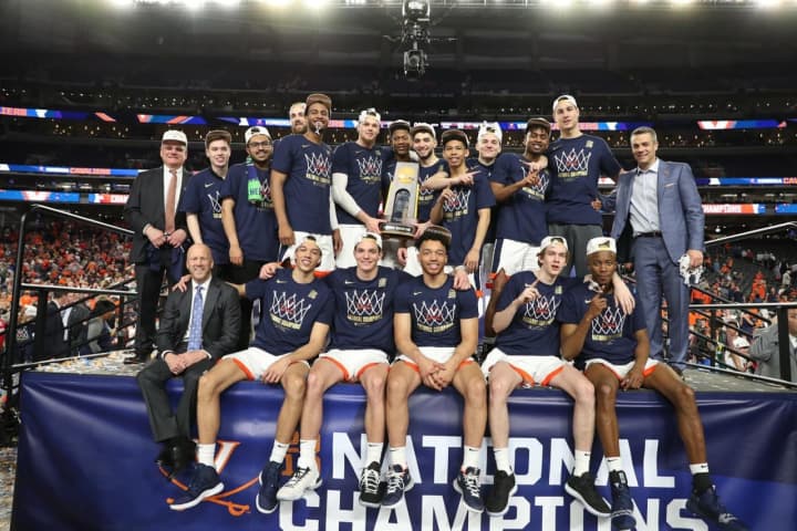 Iona Prep graduate Ty Jerome and the Virginia Cavaliers cut down the nets at the NCAA Tournament.