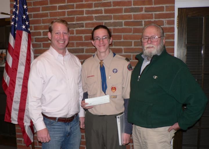 Thomas Shiskin, a member of Monroe Boy Scout Troop 62, with Aaron McGoldrick, left, president of the land trust, and Karl Witalis, president emeritus.
