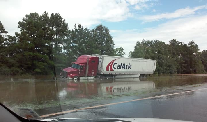 An 18-wheeler is abandoned on Interstate 12 during the Louisiana floods.