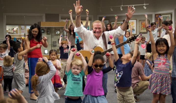 Westport is putting the finishing touches on its &quot;First Night&quot; festivities. One of the many talented performers helping it ring in 2017 will be Al deCant, aka The Singing Principal, shown here with little superstars at the Woodbridge Town Library.