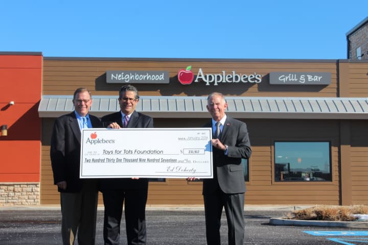 <p>From left: Kevin Coughlin, Applebee&#x27;s director of operations, David DiBartolo, vice president of operations, and Lt. General Pete Osman, president and chief executive officer for Toys for Tots</p>