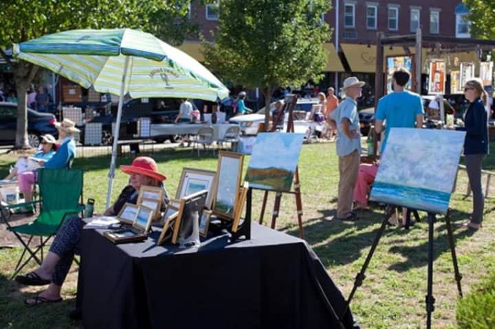 Art lovers roam around the 2015 Art in the Park in downtown Piermont.