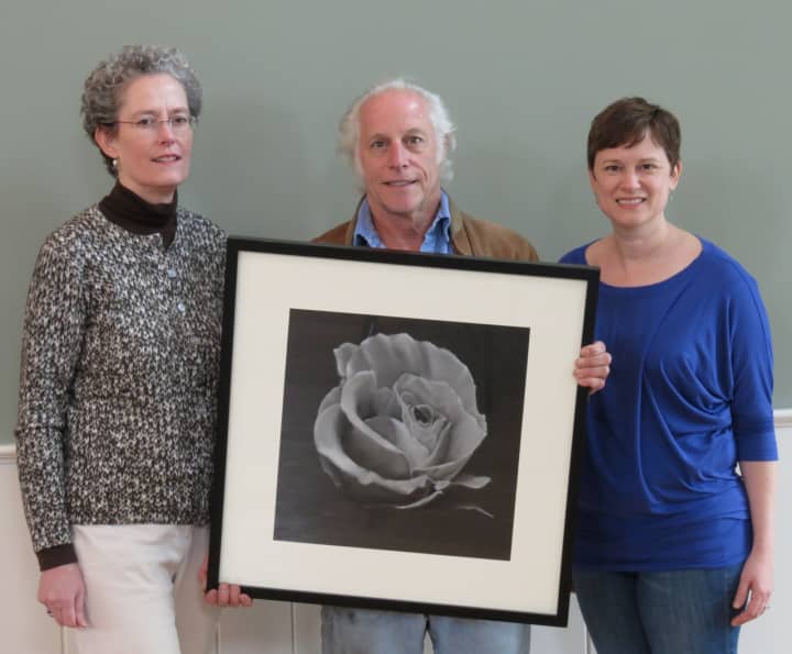 From left: Weston artists Christine Juneau, event co-chair, and Joel Sobelson (with “Anita’s Rose,” a pastel he’s submitted to be auctioned), join Rev. Katharine Piazza, Emmanuel’s Priest-in-Charge.