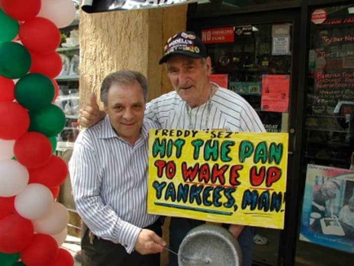 Anthony Artuso Sr., left, hams it up in 2010 with Freddy Schuman, the Yankees&#x27; late unofficial mascot. Artuso, of the famed pastry makers of the same name, has reopened his baked goods operation in Mount Vernon after a devastating 2014 factory fire.