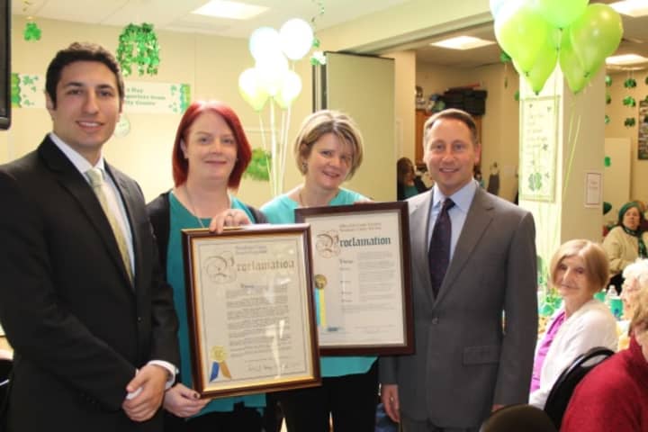 Westchester County Executive Robert P. Astorino (right) and Legislator David Tubiolo (left) present proclamations to Órla Kelleher, executive director of the Aisling Irish Community Center, and Caitriona Clarke, chairperson of the board.