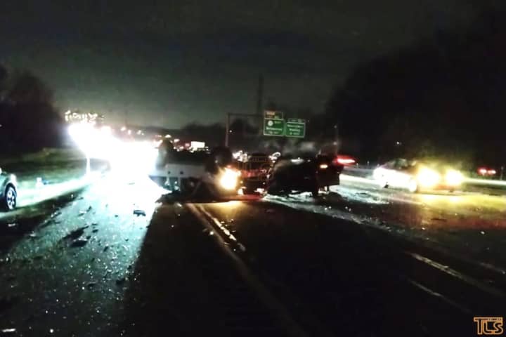 A Philadelphia driver and a Jersey City man in one of the four cars she hit after overturning into oncoming traffic Wednesday night on the Garden State Parkway were killed, New Jersey State Police said.