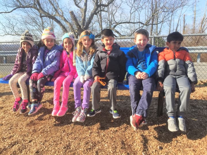 Students at Coman Hill Elementary School in Armonk try out its new &quot;Buddy Bench.&quot; It&#x27;s a simple way, school officials say, of eliminating loneliness and fostering friendships on the playground.