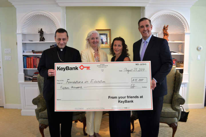 Bishop Frank Caggiano; Holly Doherty-Lemoine, Executive Director of the Foundations in Education; Bonnie Geppert and Matt Fair of KeyBank