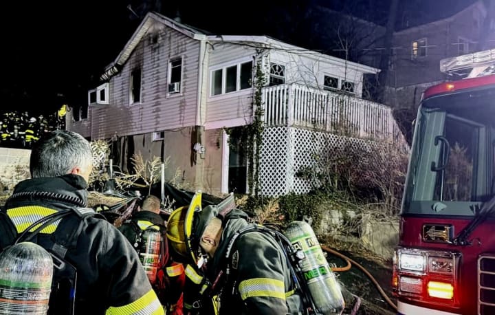 Two police officers who found the home at 2303 Lakeside Avenue "engulfed in flames with heavy smoke conditions" shortly before 12:30 a.m. Monday, Feb. 26.