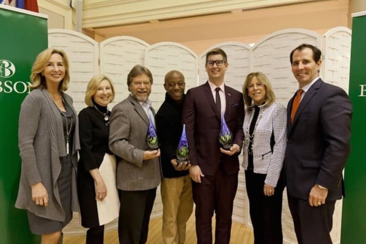 Dion Drew, fourth from left, representing Greyston Bakery founder Bernie Glassman; Bill Bolling, former executive director of the Atlanta Community Food Bank, third from left; and Gavin Armstrong, founder of Lucky Iron Fish, show off the awards.