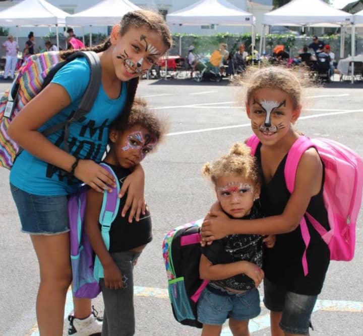 Yonkers students receive backpacks and school supplies at a recent back-to-school barbecue for kids, parents and guardians in Leake &amp; Watts’ Family Preventive Services programs in the Bronx.