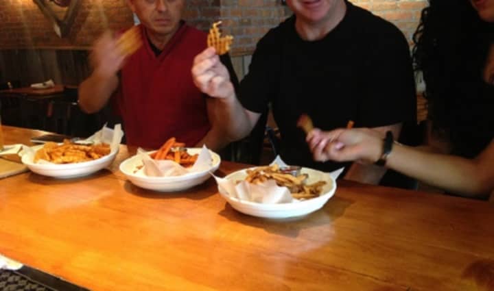 Customers chow down on heaping plates of fries at The Barley House in Thornwood.