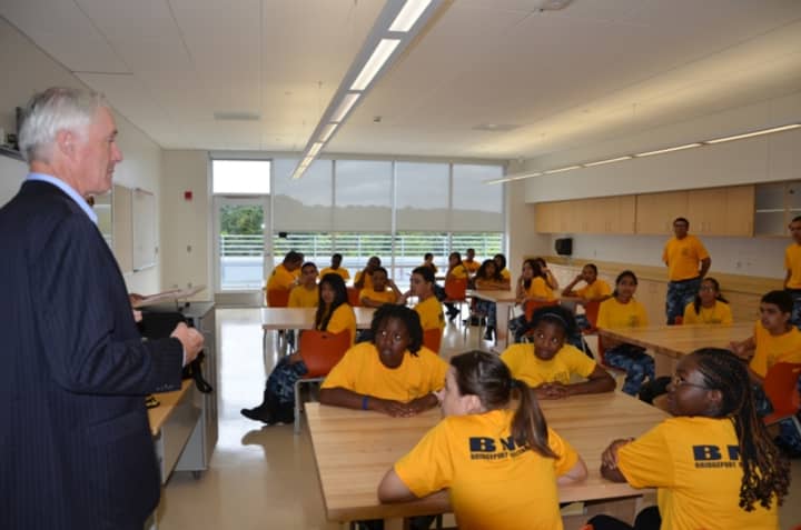Former Bridgeport Mayor Bill Finch talks to students at the Bridgeport Military Academy. Thirty cadets from the high school recently participated in their first drill meet, winning a trophy for outstanding sportsmanship.