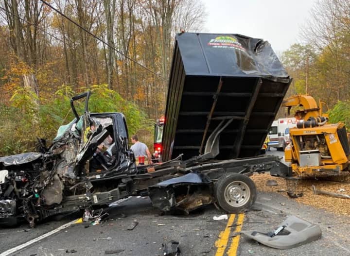 A truck driver involved in a fatal three-vehicle crash involving a school bus has been cited in the crash.