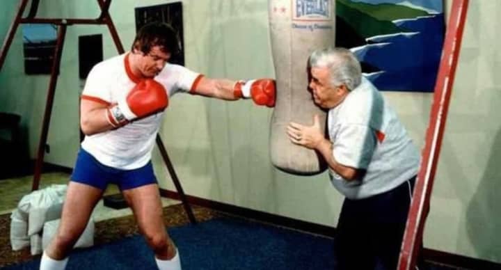 Lou Duva, right, working with one of the many championship boxers he trained.