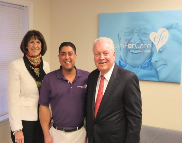 Fairfield Chamber of Commerce President Beverly Balaz, left, and First Selectman Mike Tetreau, right, were on hand at the opening of Neil Anand&#x27;s ComForCare office in  Fairfield.