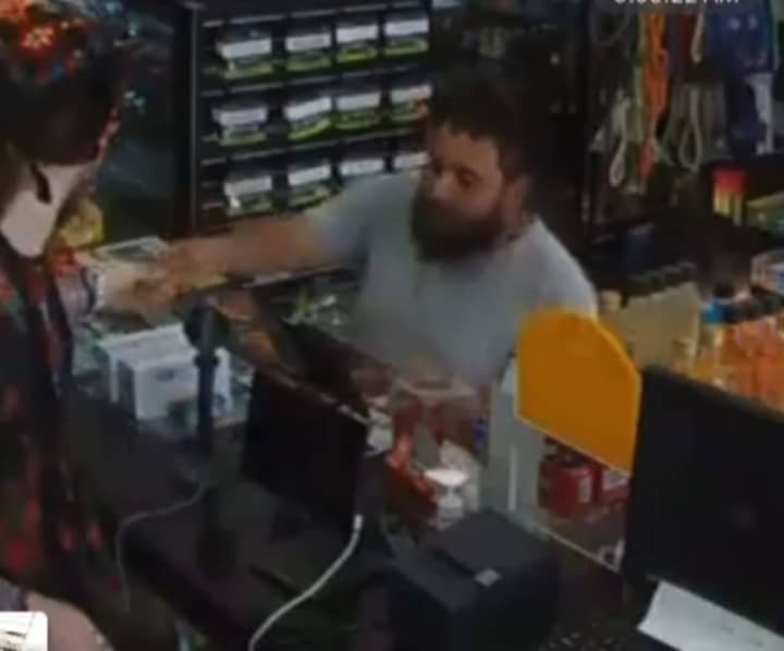 Police are searching for a man who is accused of using a stolen credit card at a tobacco shop in Huntington Station.