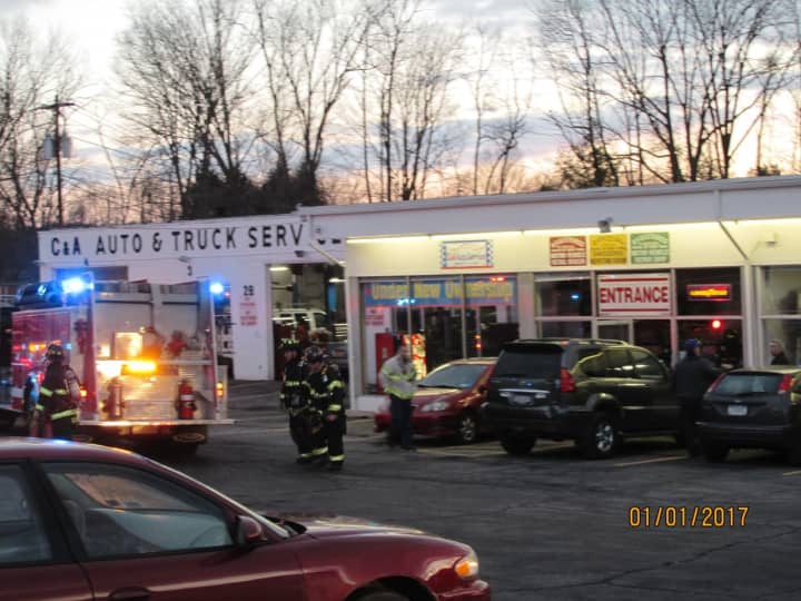 Emergency responders at C &amp; A Auto Service on Route 6.