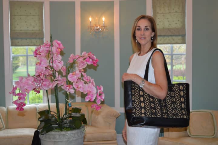 Cathy Zahn of Franklin Lakes shows off models one of her bags.