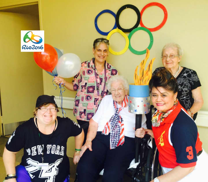 From left, Staci Hickey, Georgina Garcia, Catherine Carpenter, Lucille Lopez and Marilyn Hoermann get into the Olympic spirit.
