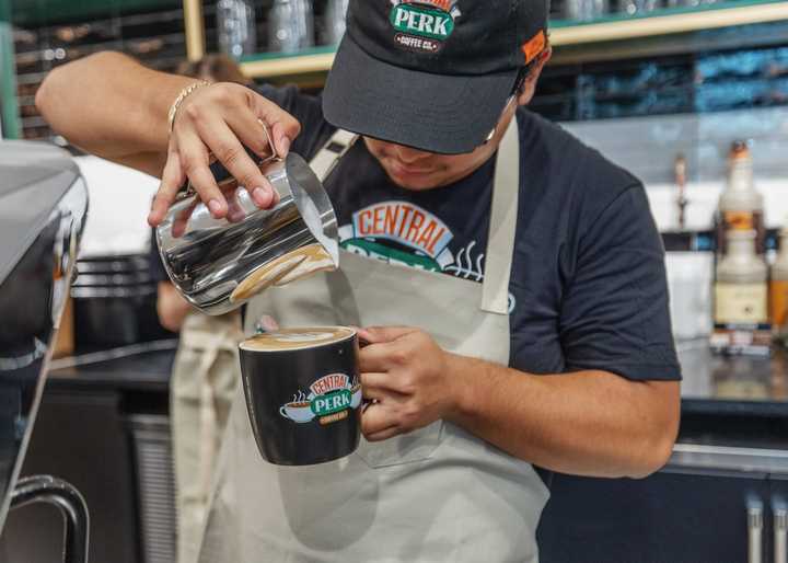 A barista makes coffee at Central Perk Coffeehouse at&nbsp;205 Newbury Street.