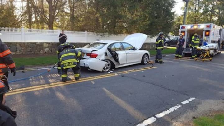 Greenwich firefighters come to the aid of a driver needing extrication after a crash on Riversville Road on Sunday.
