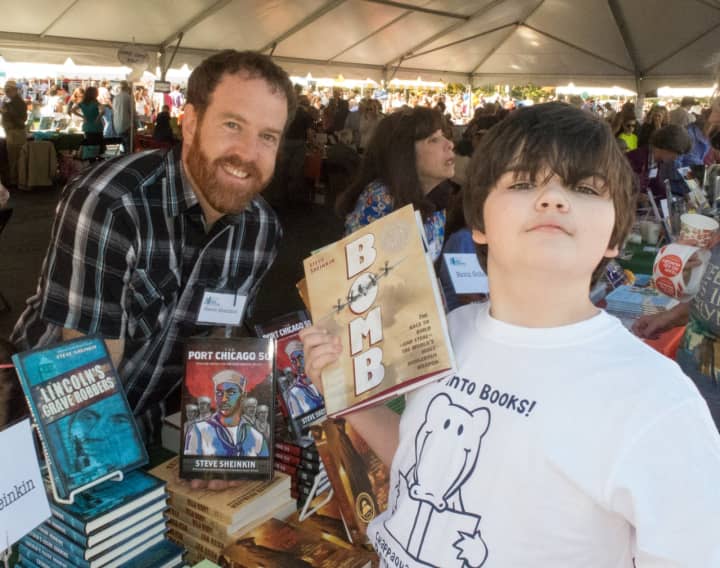 Author Steve Sheinkin with middle schooler Jackson Greenberg at the 2014 Chappaqua Children’s Book Festival.