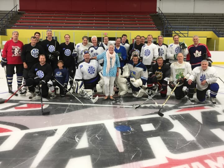 Darien Winter Club ‘Charity Skate’ Players with P2P Executive Director Ceci Maher
