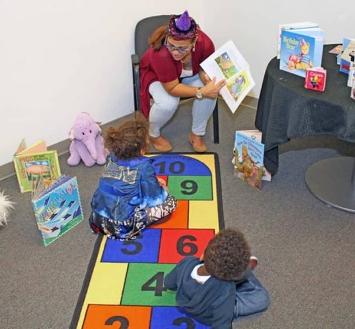 Children are read to at the Child Care Council of Westchester. The Scarsdale-based nonprofit, which aims to be both a resource and referral service, is raising money via a social media campaign to buy &quot;Brain-Building Kits.&quot;