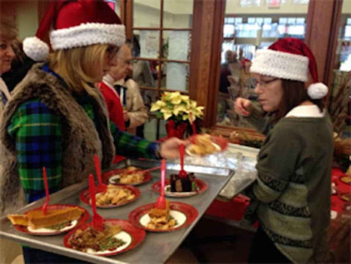 Volunteers will serve up a Christmas luncheon at Saugatuck Congregational Church in Westport on Friday, Dec. 25..