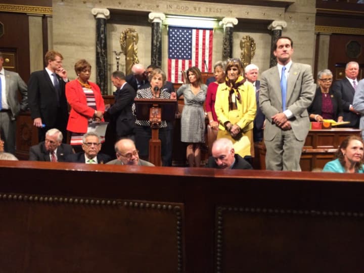 U.S. Rep. Jim Himes, standing right, joins U.S. Rep. Rosa DeLauro, left, and U.S. Rep. Elizabeth Esty, seated, in a sit-in on the floor of the U.S. House on Wednesday.