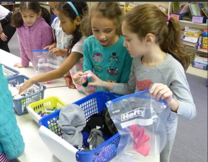 West Patent Elementary School students create care packages for a community service project.