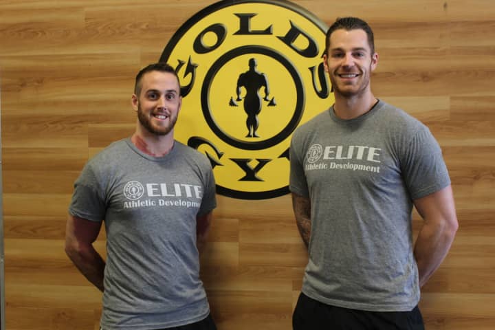 Left to right: Scott Zobre and Corey Phillips work as personal trainers at Gold&#x27;s Gym Dutchess County.