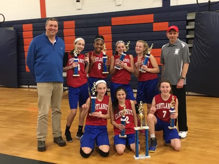 The Cortlandt eighth-grade girls travel basketball team after defeating New Rochelle for the A Division Tri-County Basketball League title.