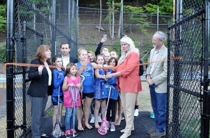 Cortlandt Supervisor Linda Puglisi gets ready to snip the ribbon during the grand opening of the town&#x27;s new lacrosse field last year. She counts the field among the town&#x27;s accomplishments for 2016.