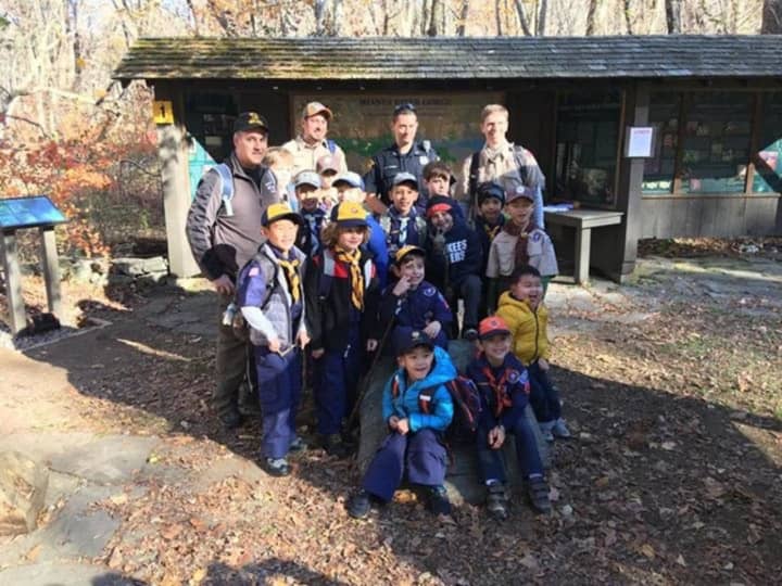 Left to right: Bill McCormack, Troop Leader Robert Coppola, Officer Doug Romero, and Troop Leader Chris Desforges along with the Bedford/Pound Ridge Pack 170 Cub Scouts.