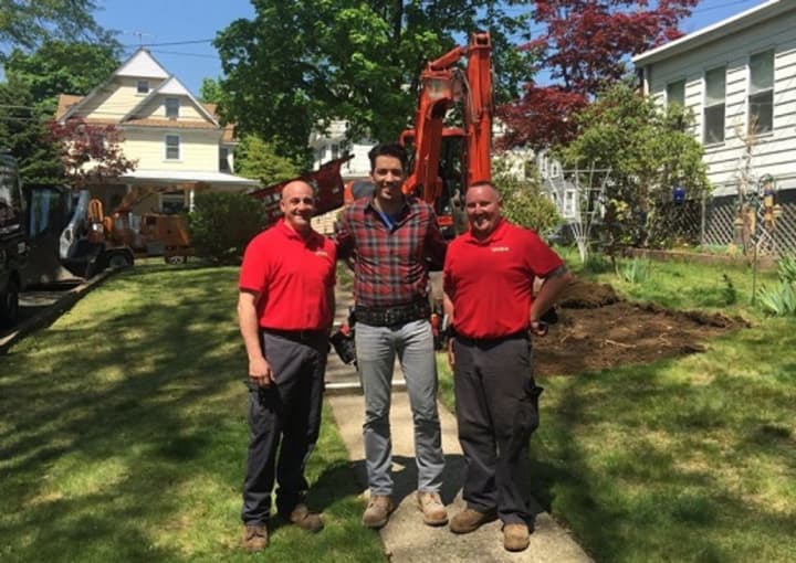 Jonathan Drew of HGTV&#x27;s &quot;Property Brothers,&quot; center, poses with employees of Curti Landscaping, from left, Dave Rosenfeld and TJ Farkas.