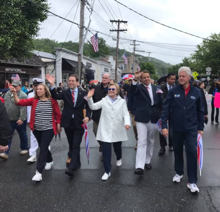 Hillary Clinton, Andrew Cuomo and Bill Clinton march in the New Castle Memorial Day Parade.