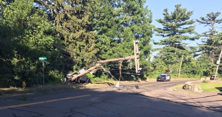 A toppled power pole forced Norwalk police to close Spring Hill late Wednesday afternoon.