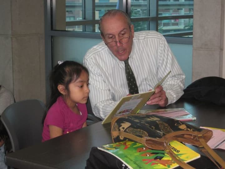 Westchester Deputy County Executive Kevin Plunkett takes part in the Reading Buddies program.