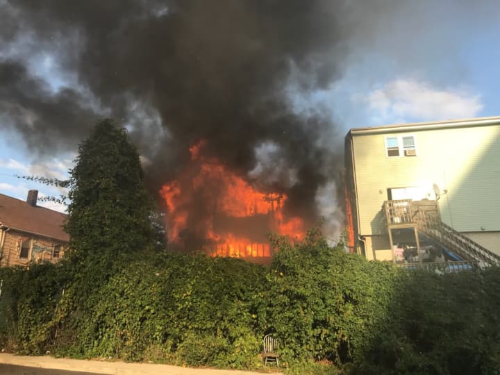 One home on Alden Street in Stamford is completely consumed by flames on Monday afternoon. The fire broke out a block from Stamford Hospital. This photo was taken before firefighters arrived by an off-duty lieutenant.