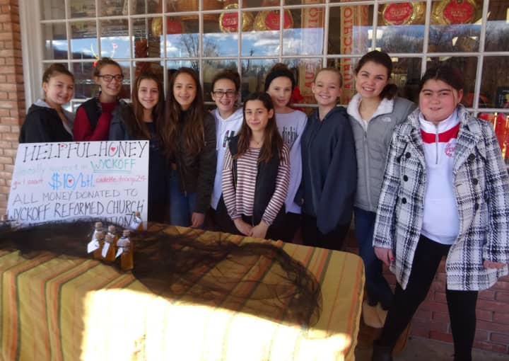 Wyckoff Girl Scout Cadette Troop 70024 sold their local honey to benefit the restoration of damaged headstones.