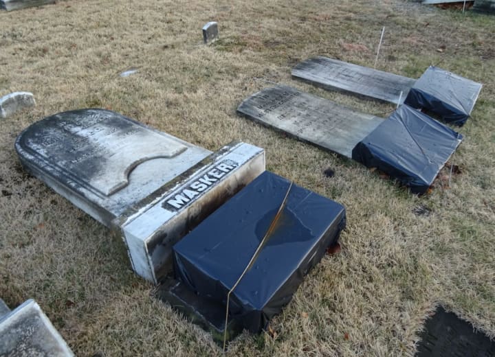 A historic stone restorer has wrapped damaged century-old headstones in the Wyckoff Reformed Church cemetery to protect them over the winter.