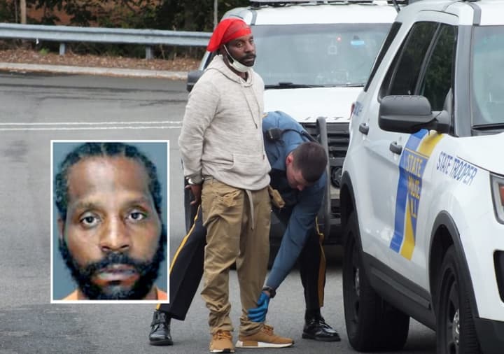 NJ State Police troopers take Greyhound bus passenger Christopher Milton of Long Island into custody on southbound Route 17 in Ridgewood.