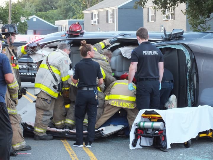 Elmwood Park firefighters work to free the trapped and injured driver.
