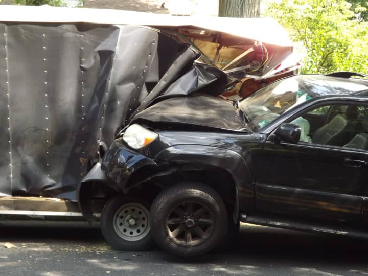 The SUV slammed into the parked trailer on Prospect.