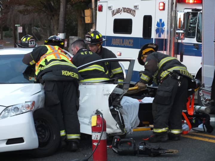 Ridgewood firefighters free the trapped Toyota Camry driver following an afternoon crash.