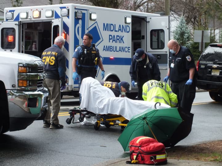 EMS workers and police tend to one of the pedestrians struck in Wyckoff.