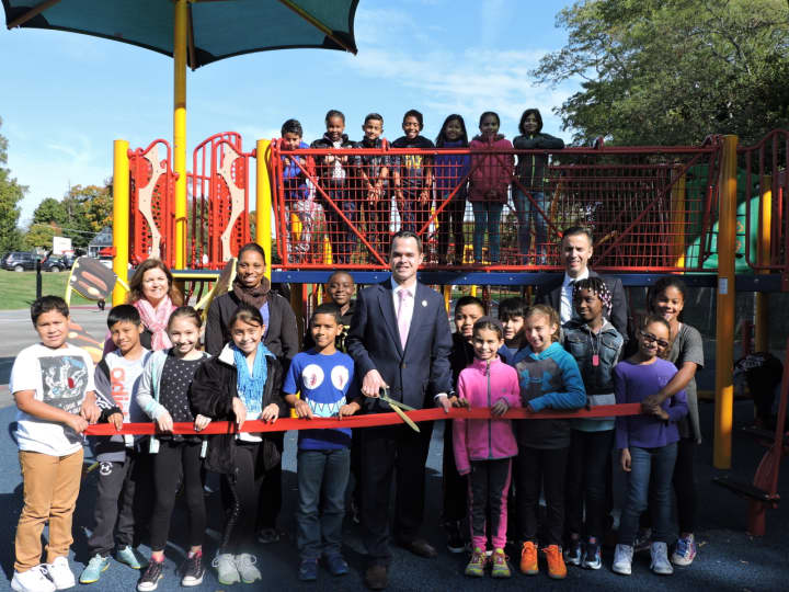 This ribbon-cutting ceremony marked the opening of the Claremont Elementary School playground.