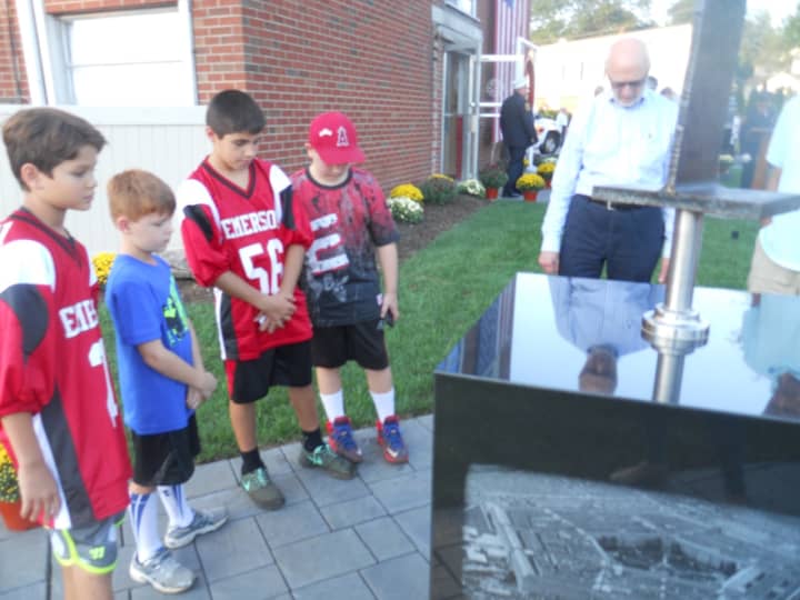 Pictured from left: Ashton El-Ansara, 10; Quinn Sureda, 7; Jack Insera, 12; and Jake Falotico, 10 reflecting on the new memorial.